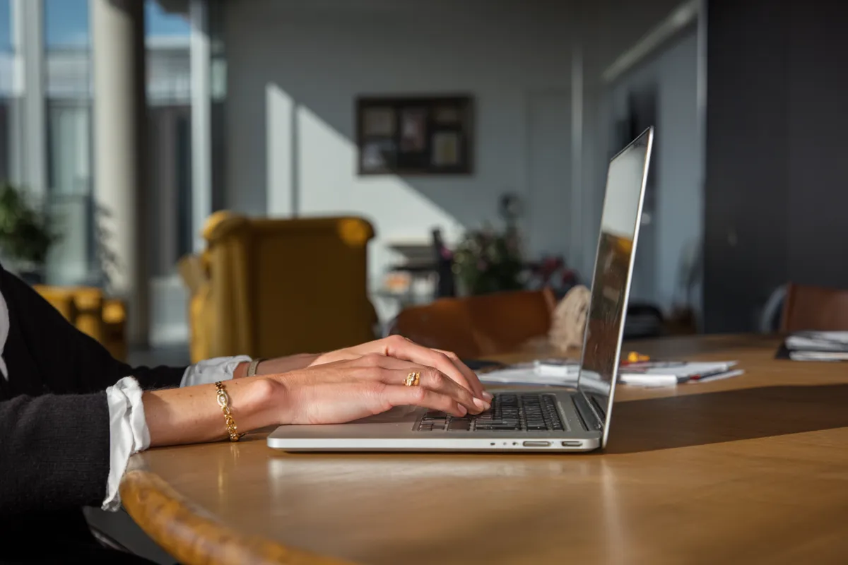 Person typing on laptop